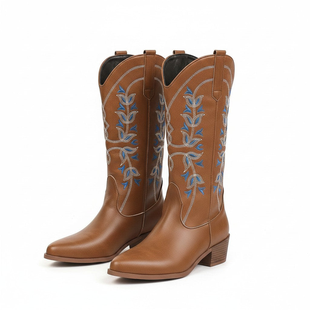 Swiftpick shop brown leatherette Western boots with blue and white floral embroidery and a pointed toe.