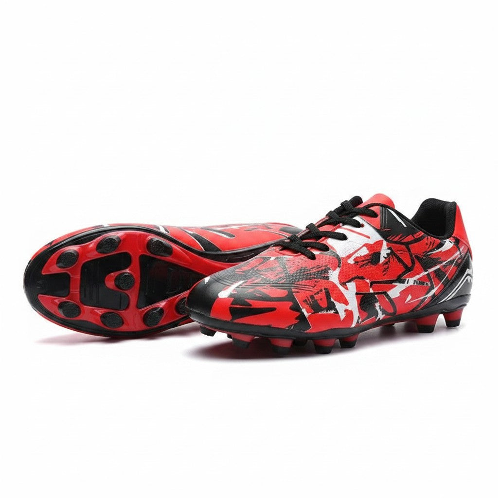 Swiftpick shop Pro-Performance low-top soccer cleats in red, black, and white with a textured graphic pattern.