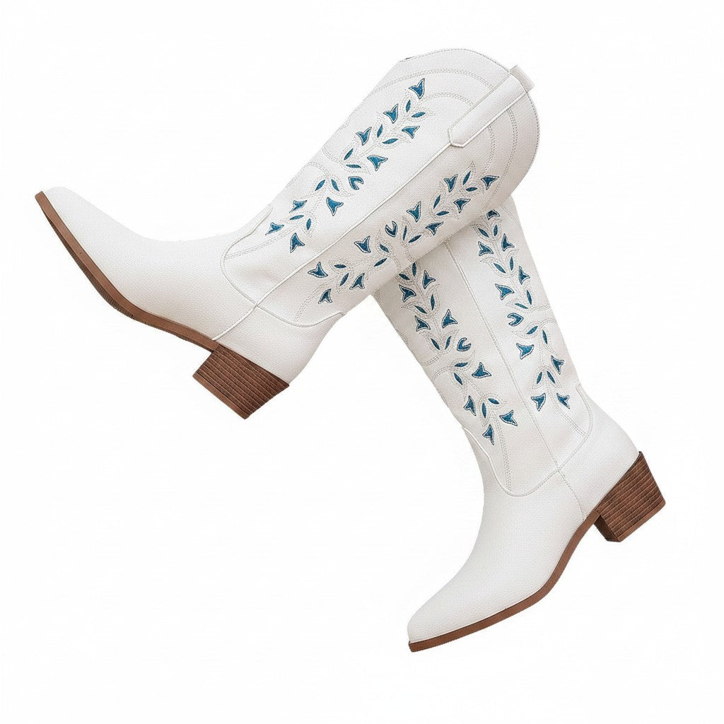 Swiftpick shop white leatherette Western boots with blue floral embroidery, pointed toe, and chunky wooden heel.
