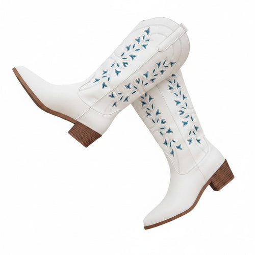 Swiftpick shop white leatherette Western boots with blue floral embroidery, pointed toe, and chunky wooden heel.