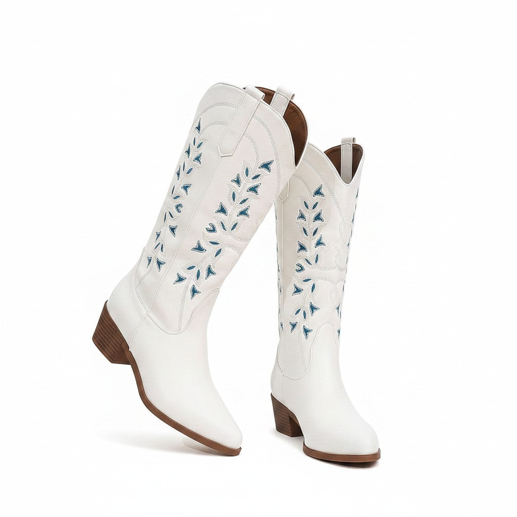 Swiftpick shop white pointed-toe Western boots with blue leaf embroidery and a chunky heel.